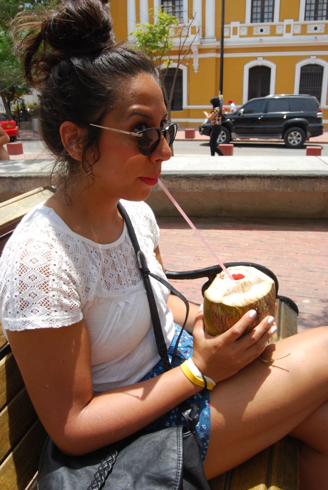 Jess drinking a "coco loco" in Santa Marta. 